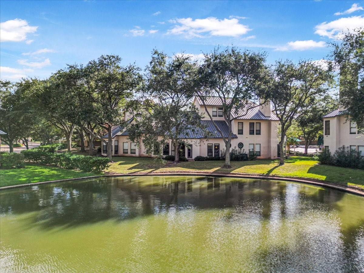 4144 Greystone Way, Unit 303 Sugar Land, TX 77479 - Photo 23 of 33 a view of a swimming pool with an outdoor space and seating area