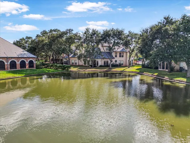 an aerial view of residential house with outdoor space and swimming pool