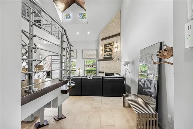 a kitchen with a sink and large windows