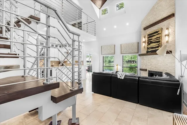 a living room with kitchen island furniture and a large window