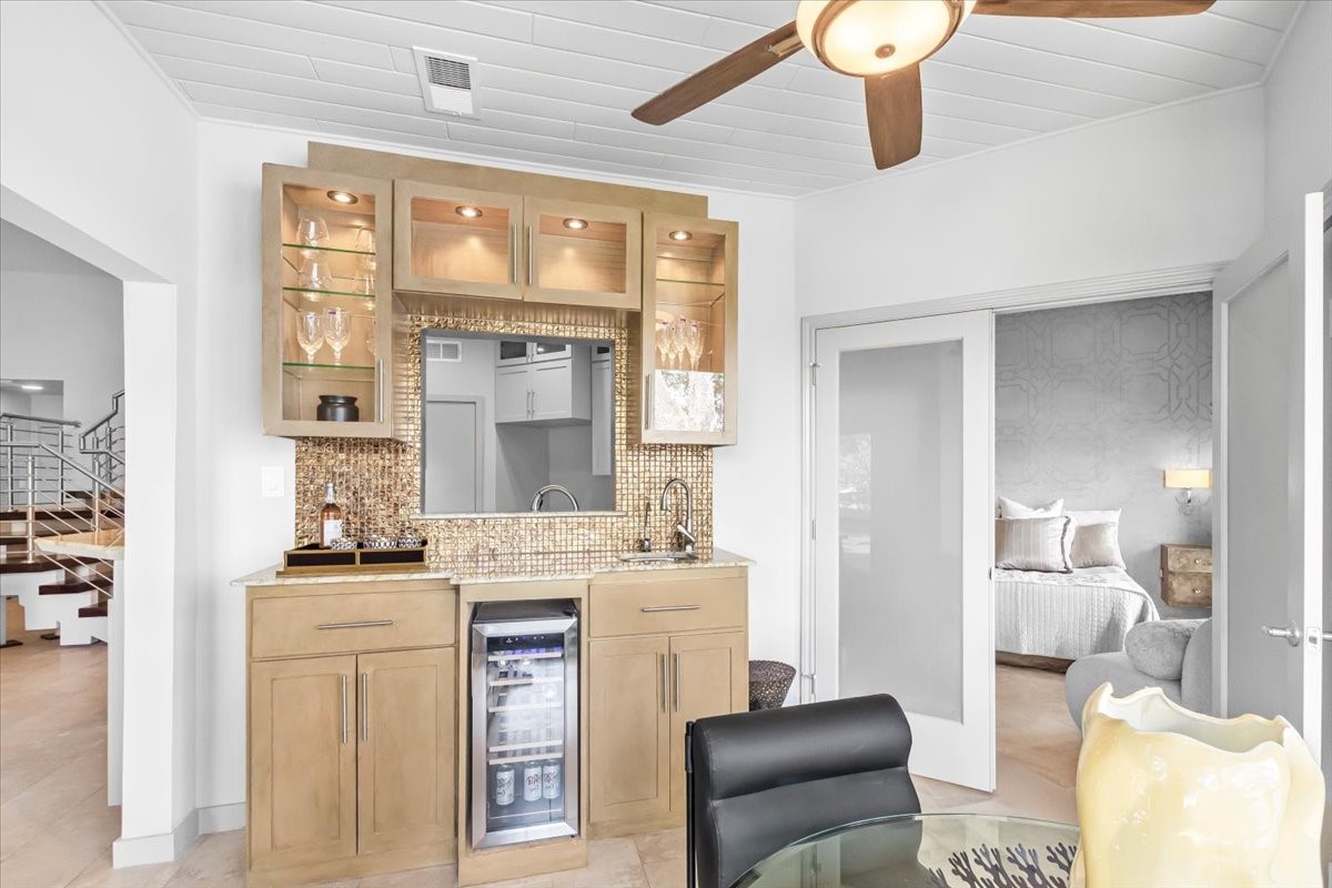 4144 Greystone Way, Unit 303 Sugar Land, TX 77479 - Photo 4 of 33 a kitchen with a stove cabinets and chairs