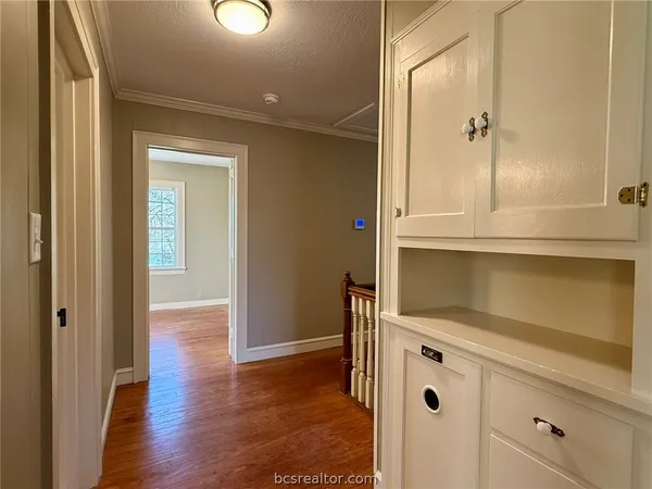 a bathroom with a shower and a sink