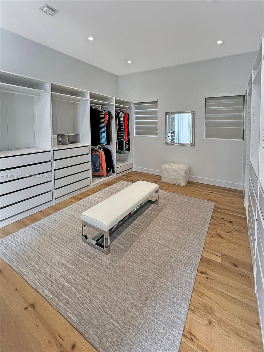 16640 Sunset Way Weston, FL 33326 - Photo 16 of 35 a room with wooden floor and windows