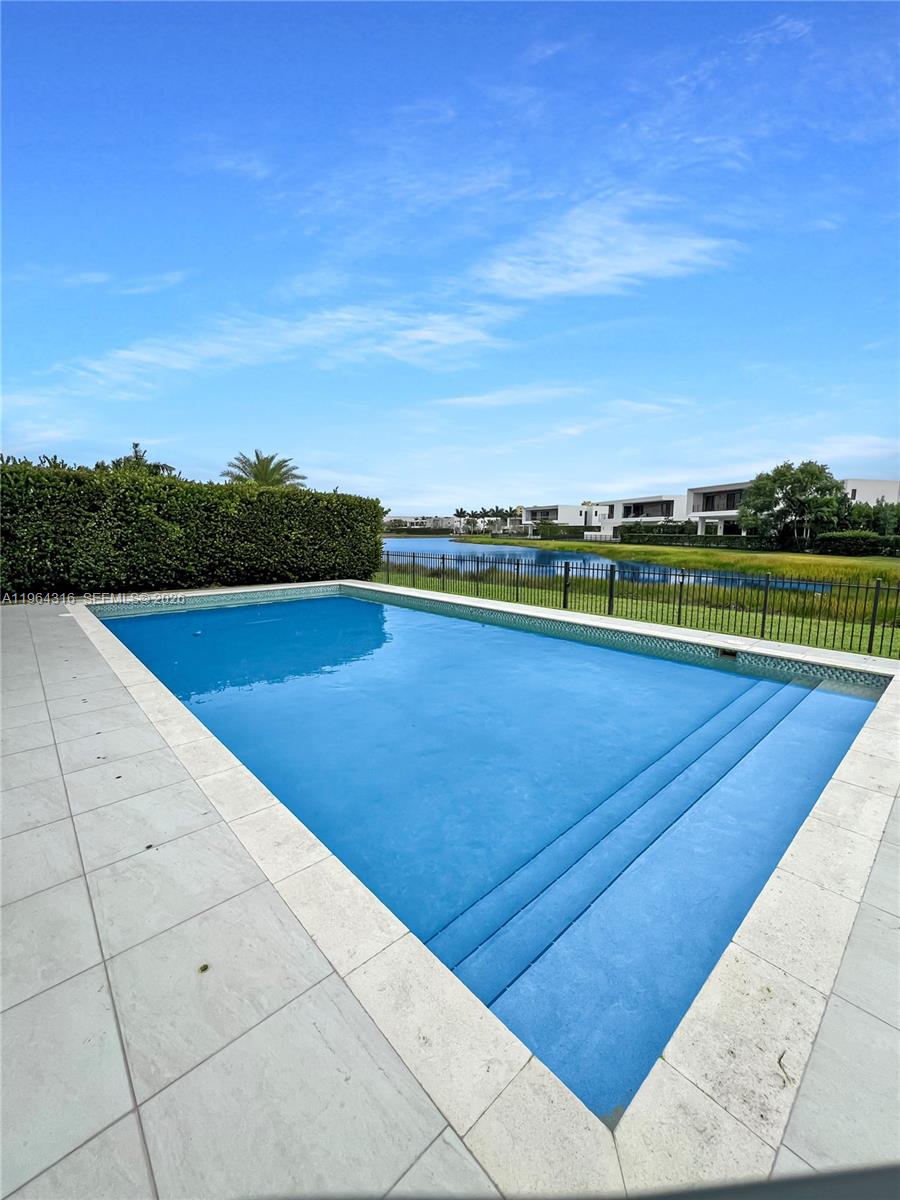 16640 Sunset Way Weston, FL 33326 - Photo 32 of 35 a view of a swimming pool and an outdoor seating