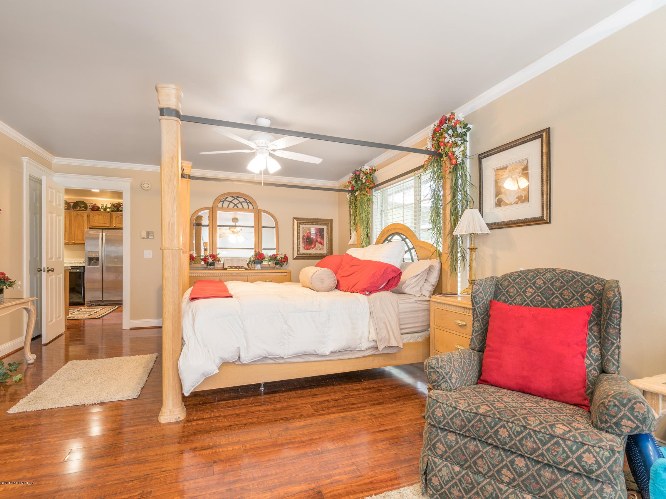 54201 Church Road Callahan, FL 32011 - Photo 19 of 37 a bedroom with a large bed and a window