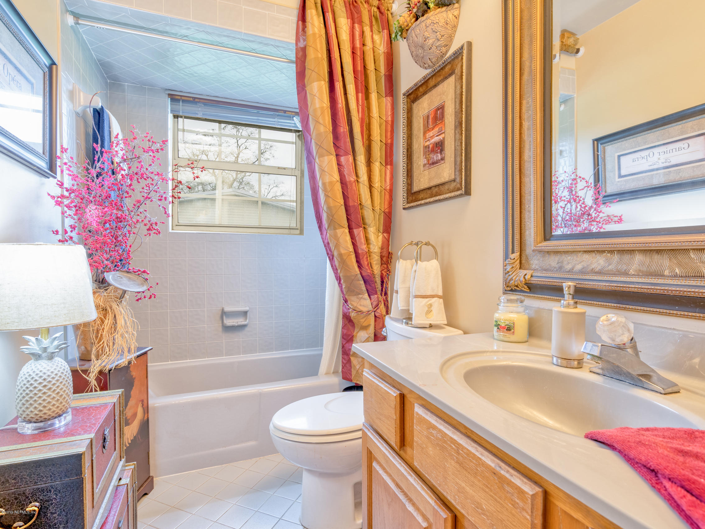 54201 Church Road Callahan, FL 32011 - Photo 23 of 37 a bathroom with a granite countertop bathtub sink vanity mirror and toilet