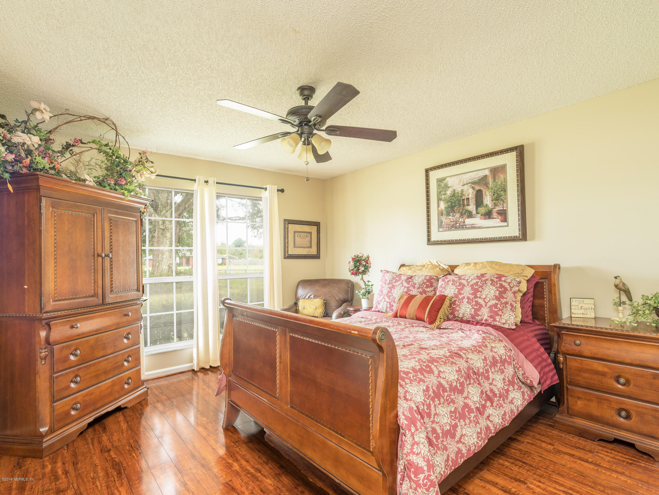 54201 Church Road Callahan, FL 32011 - Photo 24 of 37 a bed room with a bed and a window
