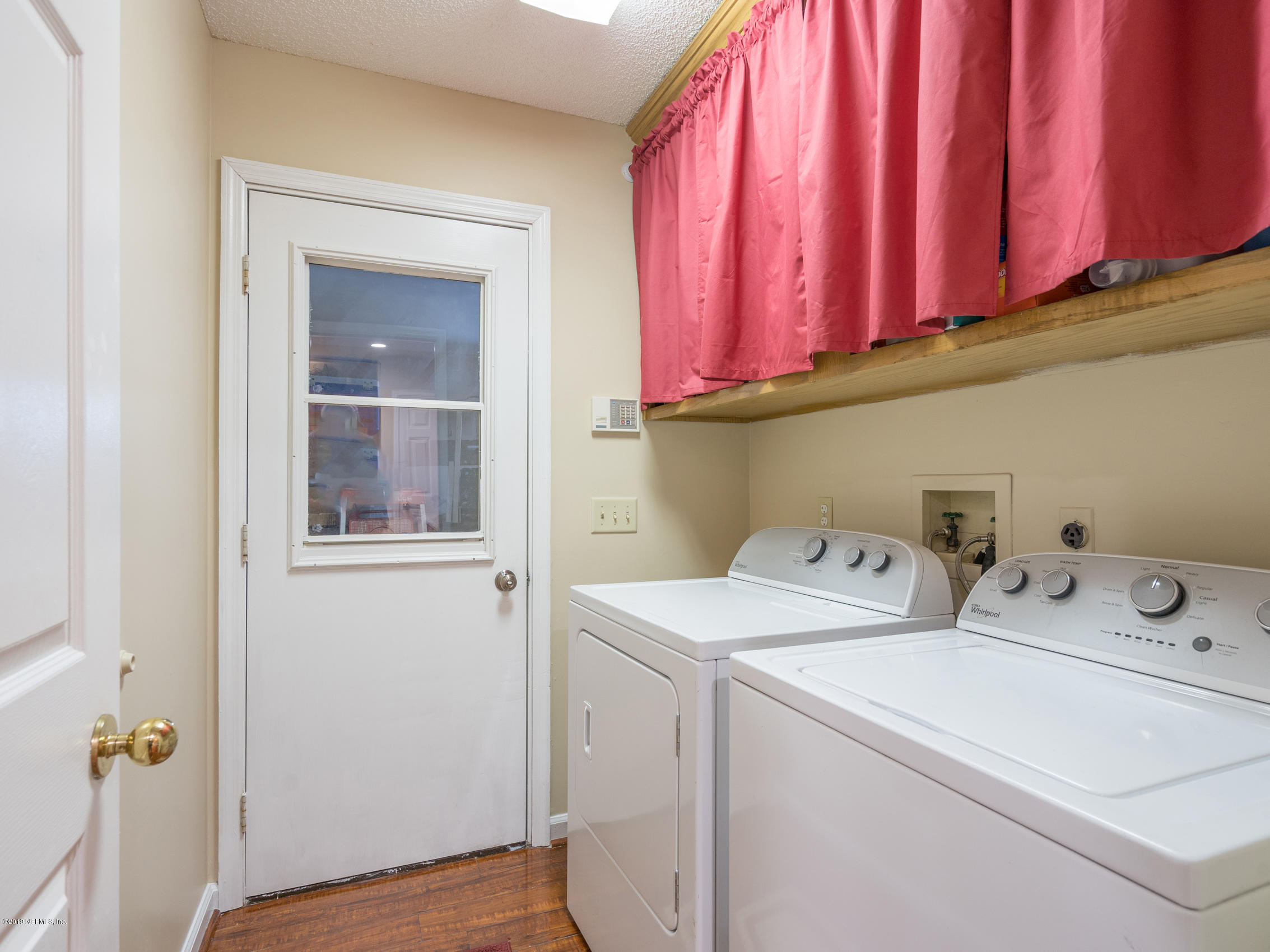54201 Church Road Callahan, FL 32011 - Photo 26 of 37 a utility room with dryer and washer