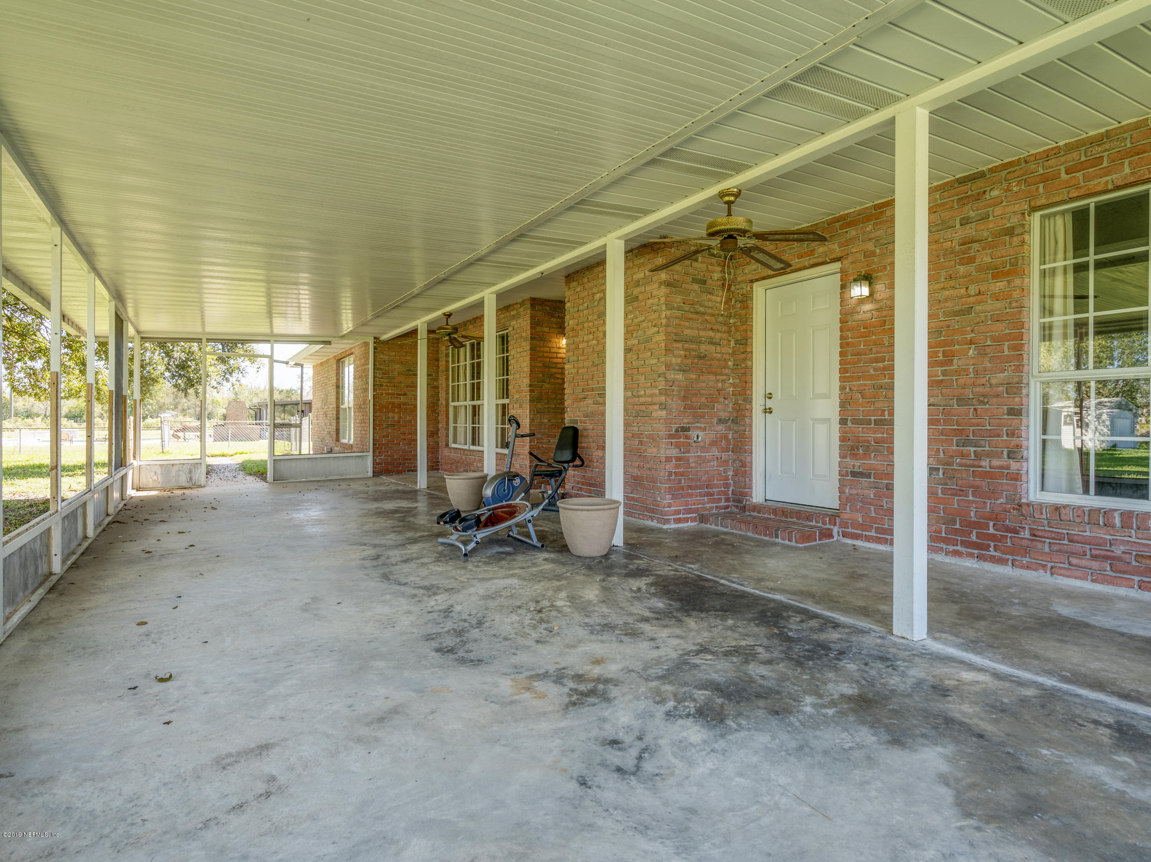 54201 Church Road Callahan, FL 32011 - Photo 28 of 37 a view of a room with wooden floor and furniture