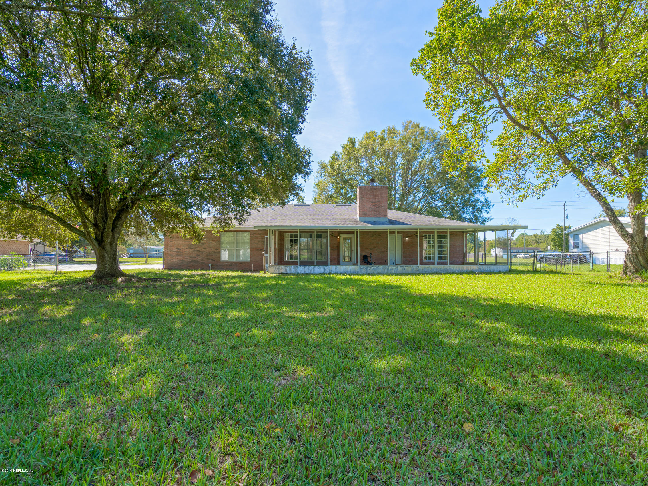 54201 Church Road Callahan, FL 32011 - Photo 29 of 37 a front view of a house with a garden