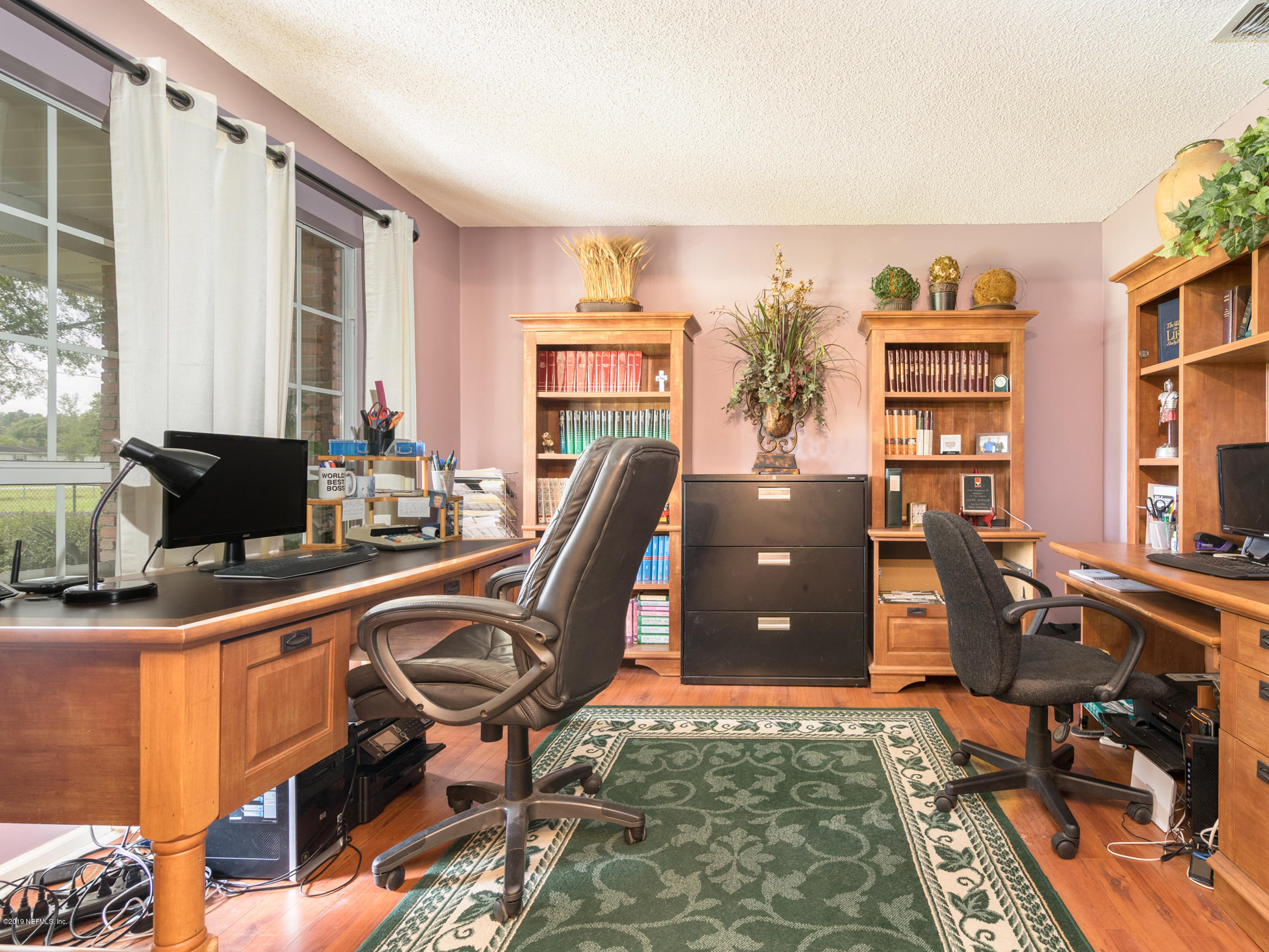 54201 Church Road Callahan, FL 32011 - Photo 3 of 37 a workspace with furniture and window