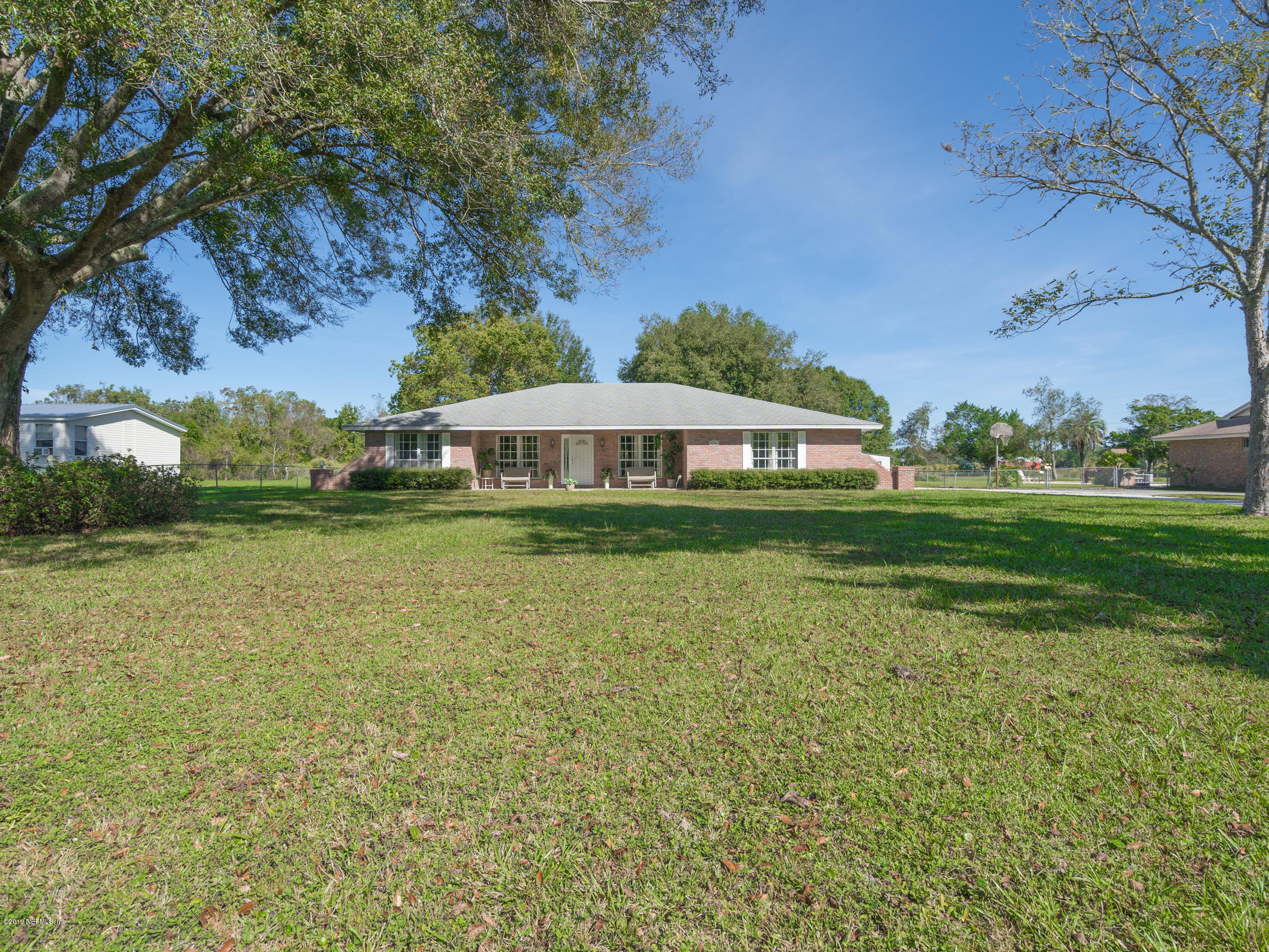 54201 Church Road Callahan, FL 32011 - Photo 35 of 37 a house with garden in front of it