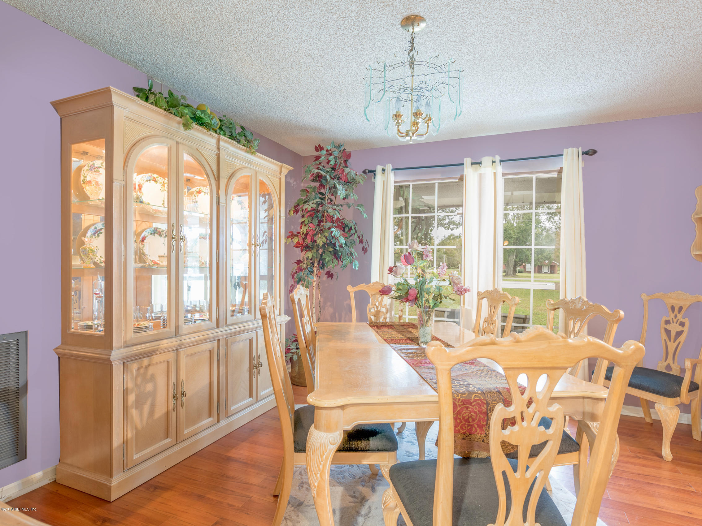 54201 Church Road Callahan, FL 32011 - Photo 5 of 37 a view of a dining room with furniture window and outside view