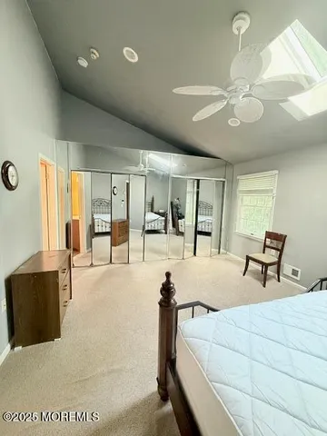 a bed room with a bed and a television