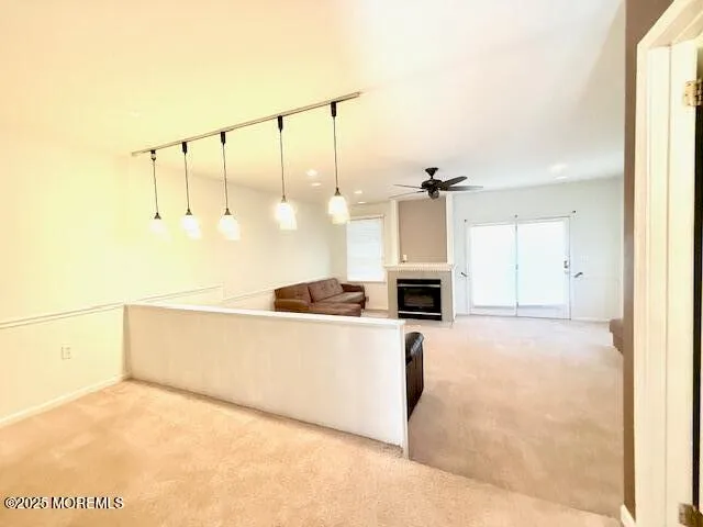a view of a kitchen with a sink and a refrigerator