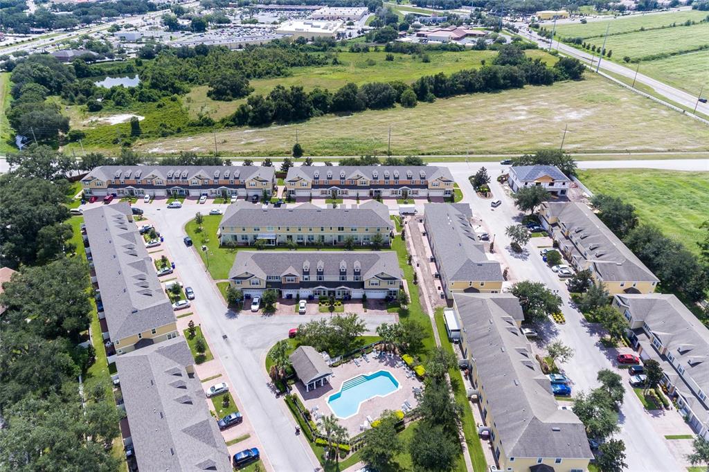 591 Pacito Way St. Cloud, FL 34769 - Photo 25 of 28 an aerial view of a house with a yard