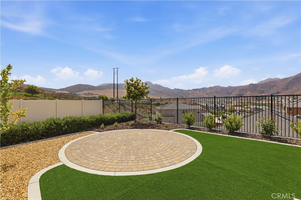 21159 Blue Jeans Court Riverside, CA 92507 - Photo 59 of 63 a view of a swimming pool with a yard and mountain view