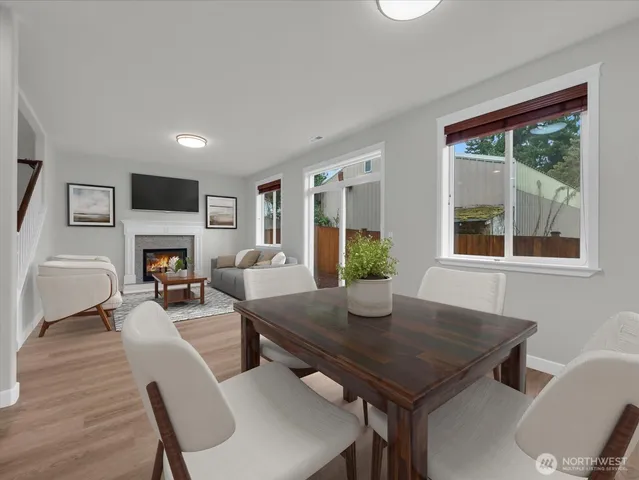 a view of a dining room with furniture window and wooden floor