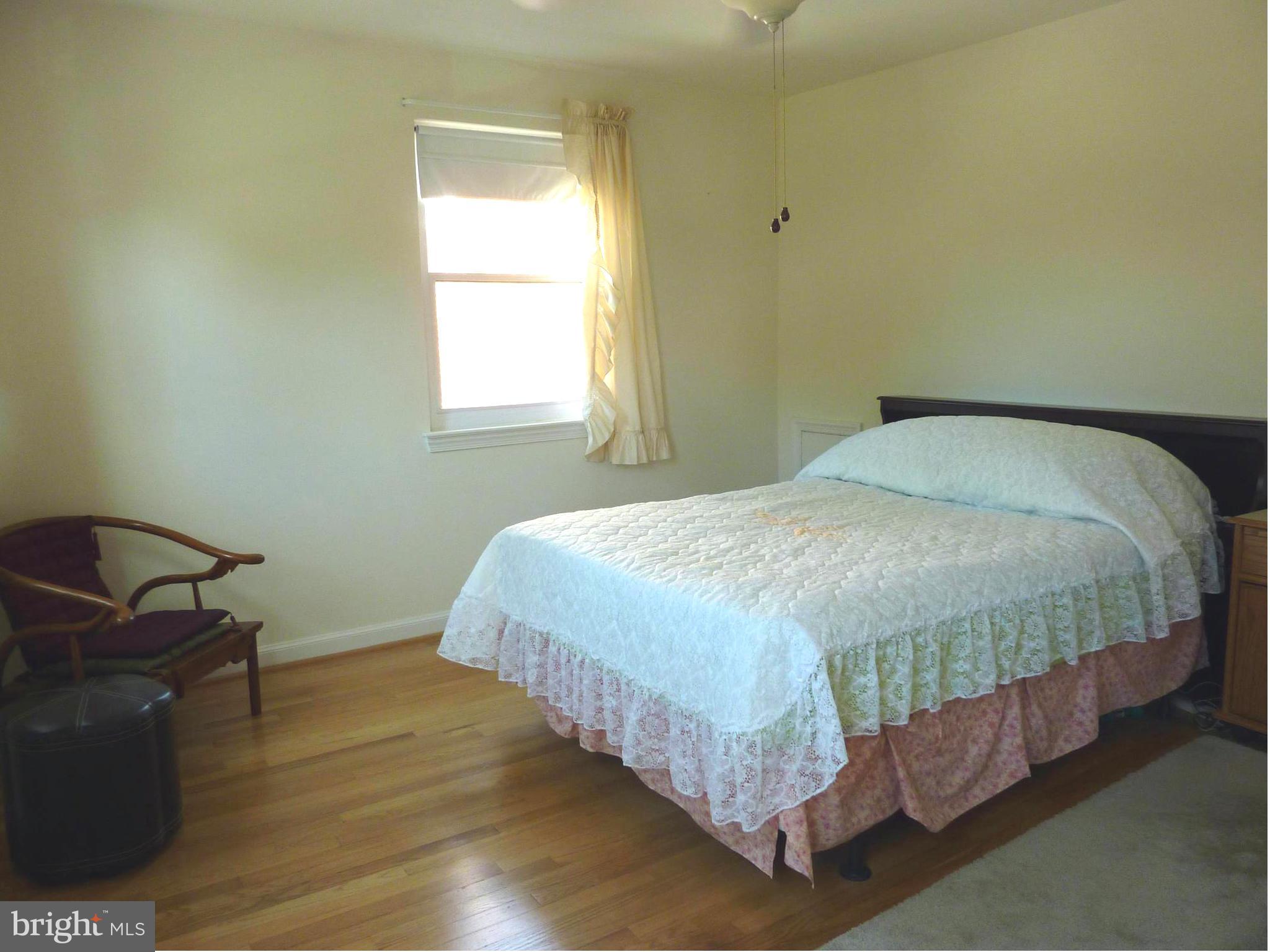 11915 Andrew Street Silver Spring, MD 20902 - Photo 12 of 25 Gleaming hardwood floors in master bedroom