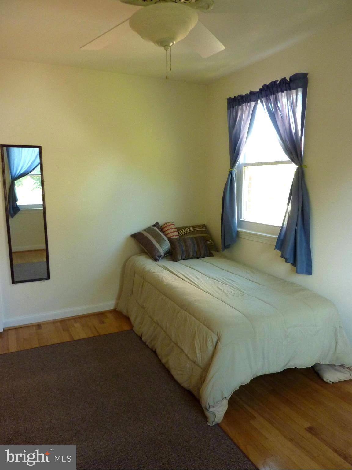 11915 Andrew Street Silver Spring, MD 20902 - Photo 16 of 25 Gleaming hardwood floors in guest room.