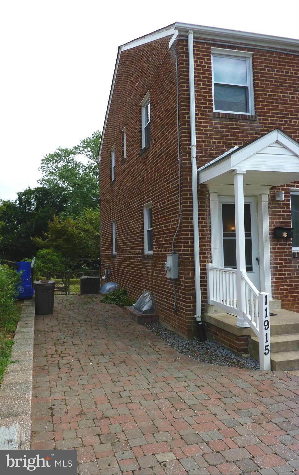 11915 Andrew Street Silver Spring, MD 20902 - Photo 3 of 25 Side view shows solid brick contruction