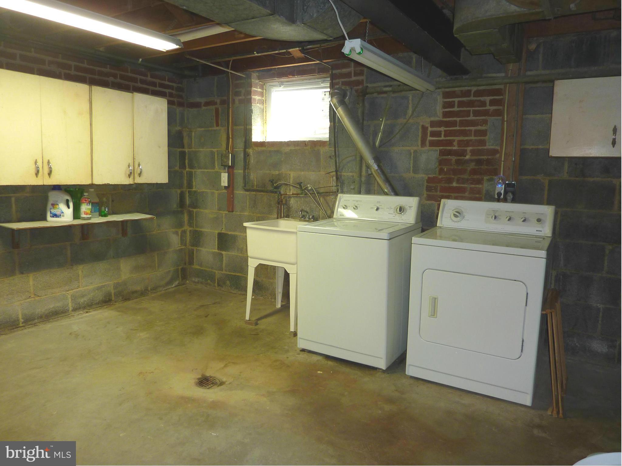 11915 Andrew Street Silver Spring, MD 20902 - Photo 21 of 25 Basement laundry room with full-size machines