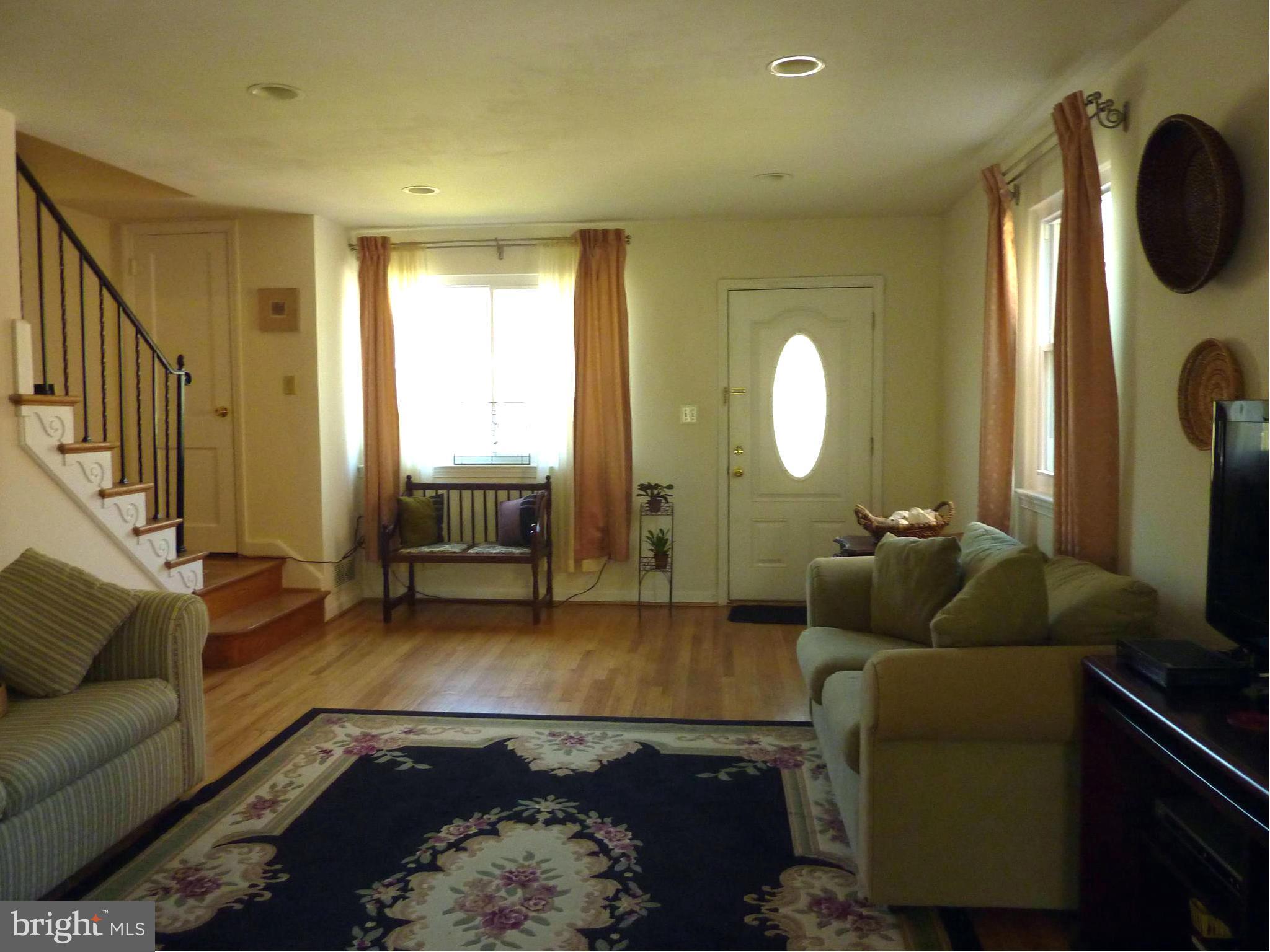 11915 Andrew Street Silver Spring, MD 20902 - Photo 4 of 25 Living room with broad window - guests arriving?