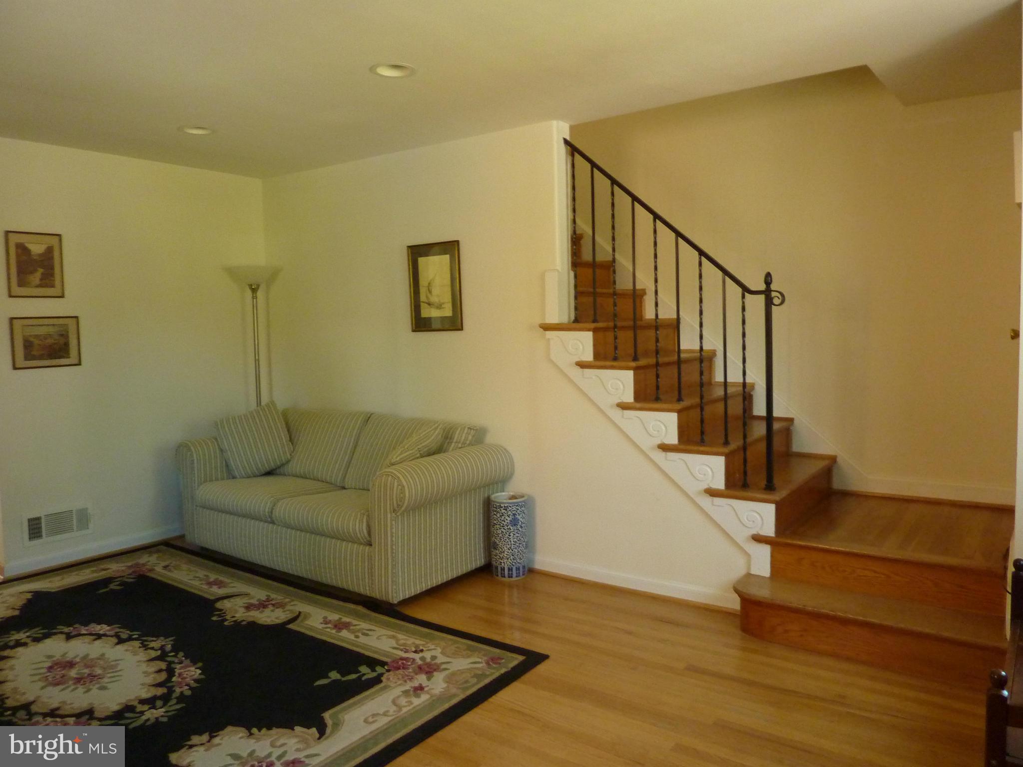 11915 Andrew Street Silver Spring, MD 20902 - Photo 5 of 25 Hardwood floors flow from living room up stairs