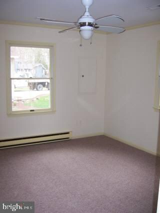20 Capetown Road Ocean Pines, MD 21811 - Photo 9 of 11 an empty room with a window and a ceiling fan
