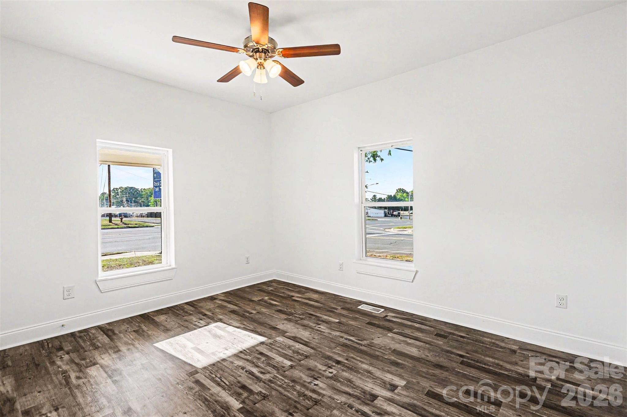 405 Aquadale Road Albemarle, NC 28001 - Photo 15 of 29 a view of empty room with wooden floor and fan