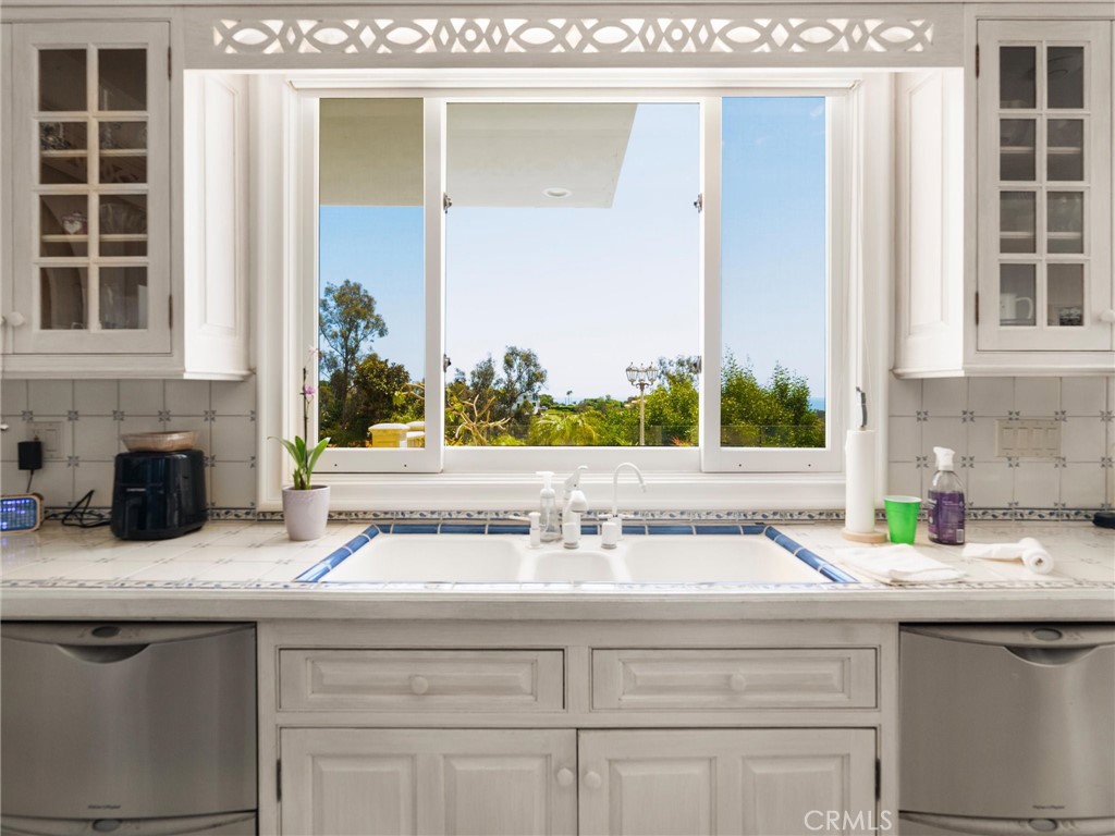 6000 Cavalleri Road Malibu, CA 90265 - Photo 22 of 44 a sink with a granite countertop sink and a mirror