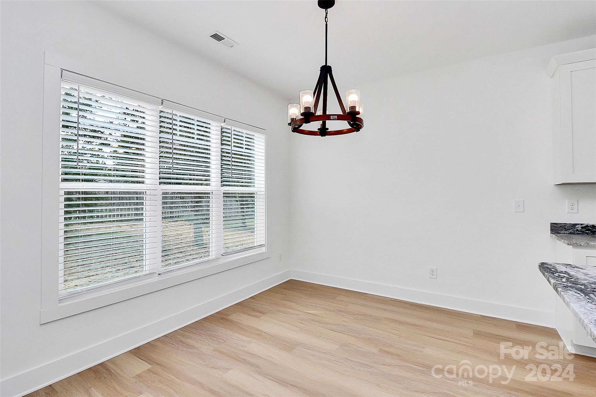 115 Starmount Drive Kings Mountain, NC 28086 - Photo 24 of 39 a view of a room with a window and wooden floor