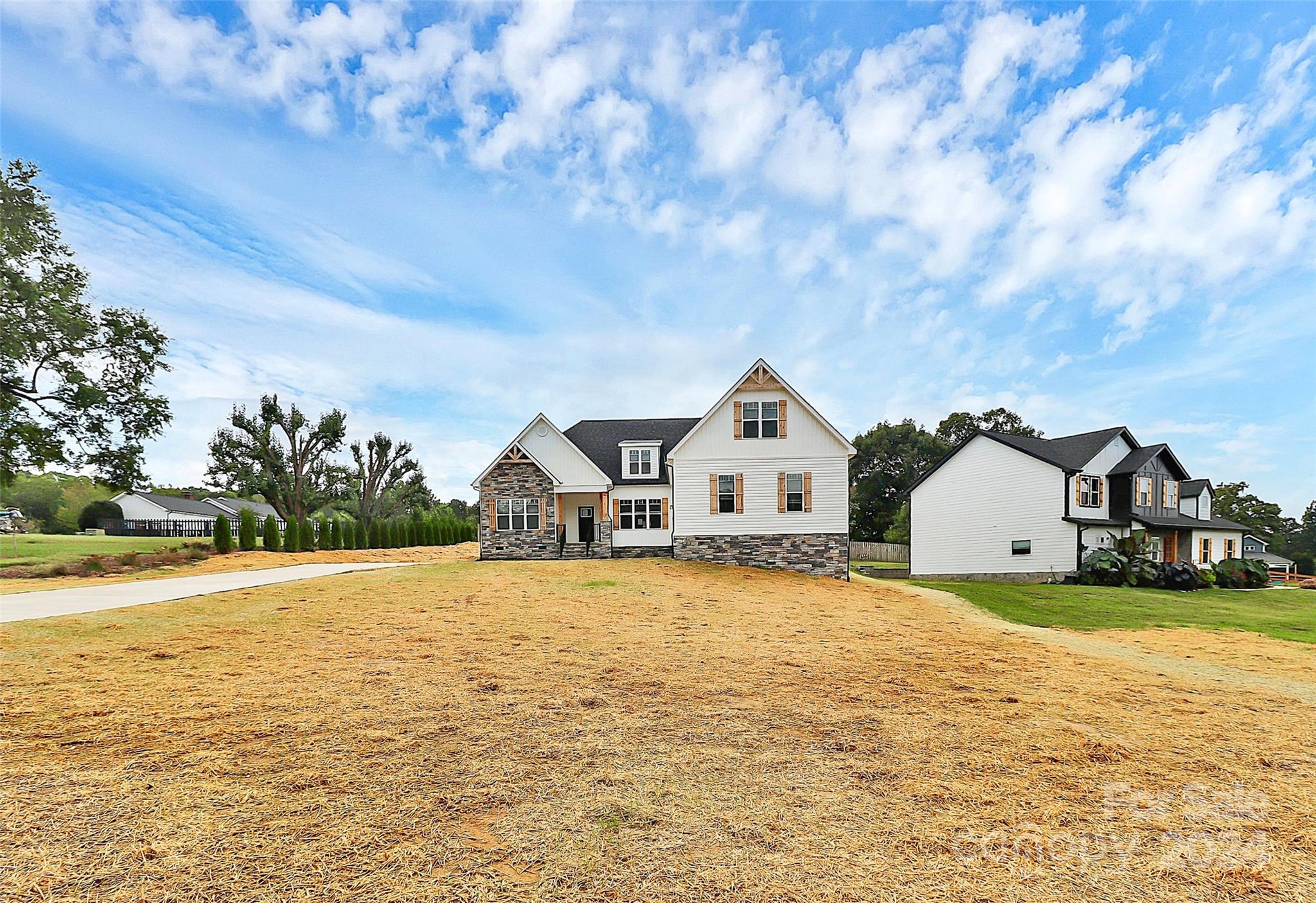 115 Starmount Drive Kings Mountain, NC 28086 - Photo 38 of 39 a view of a large house with a big yard and large tree
