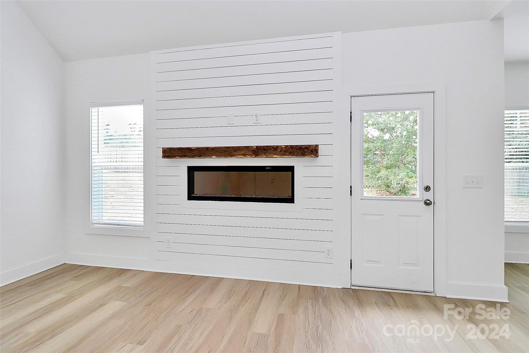 115 Starmount Drive Kings Mountain, NC 28086 - Photo 6 of 39 a view of a livingroom with wooden floor and a fireplace