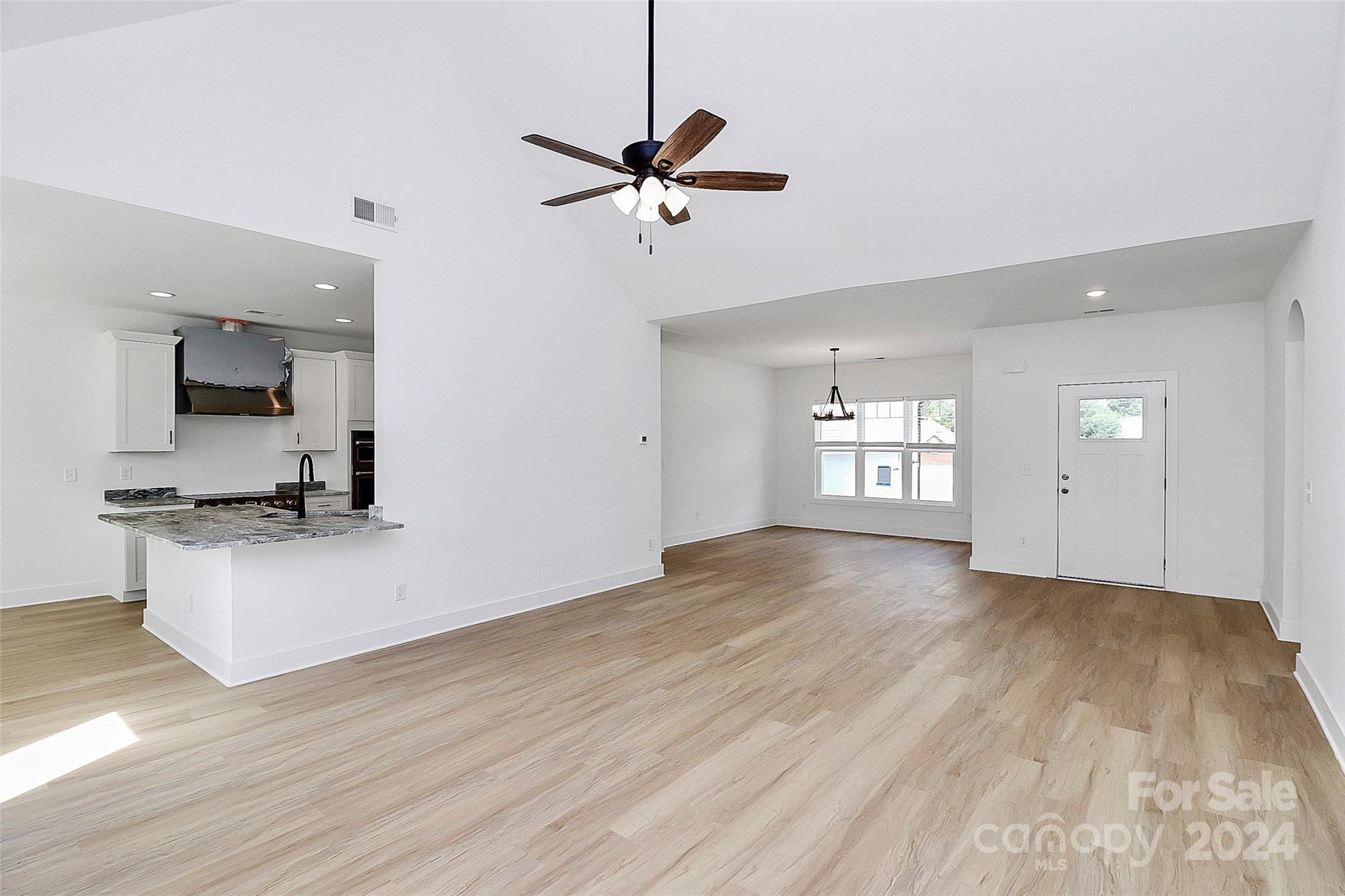 115 Starmount Drive Kings Mountain, NC 28086 - Photo 8 of 39 a view of an empty room with kitchen and window