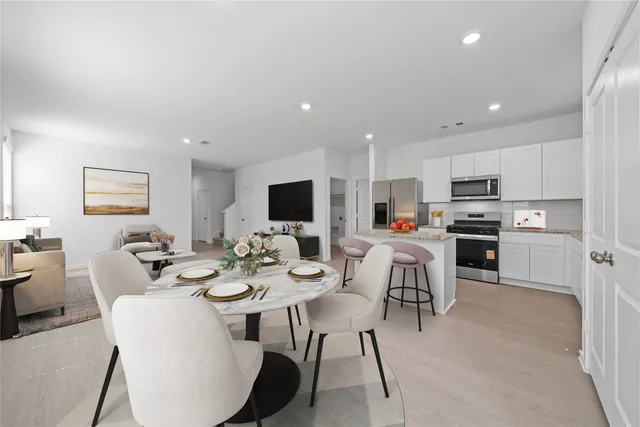 a view of a dining room with furniture
