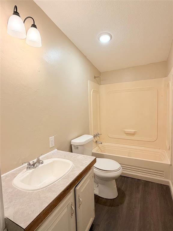 9721 Limestone Joshua, TX 76058 - Photo 29 of 36 a bathroom with a granite countertop sink a toilet and a mirror