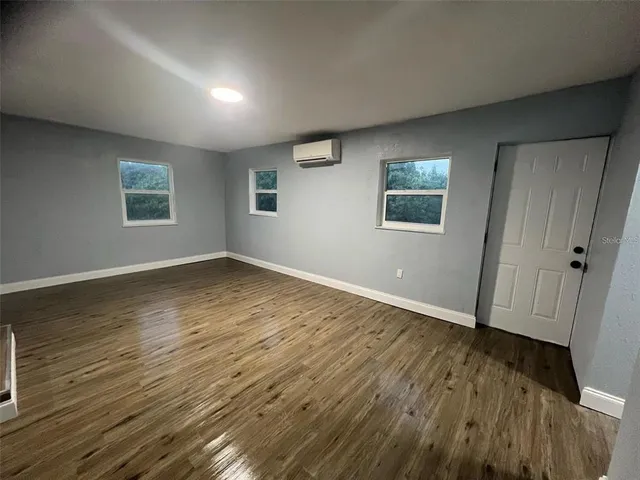 a view of hallway with wooden floor