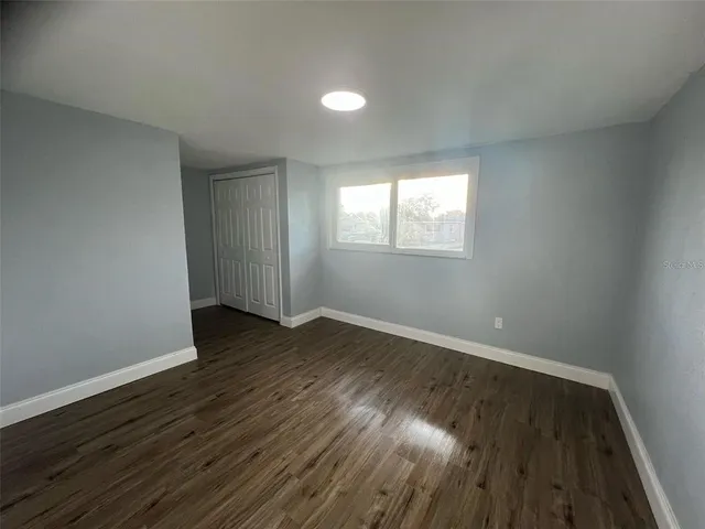 a bathroom with a double vanity sink toilet mirror and bathtub