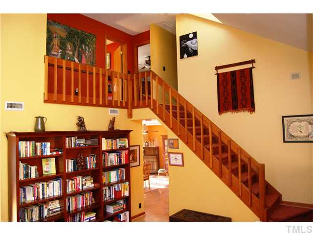 3919 Swarthmore Road Durham, NC 27707 - Photo 10 of 24 Open stair case and upstairs loft add to the open feeling of the home. Staircase