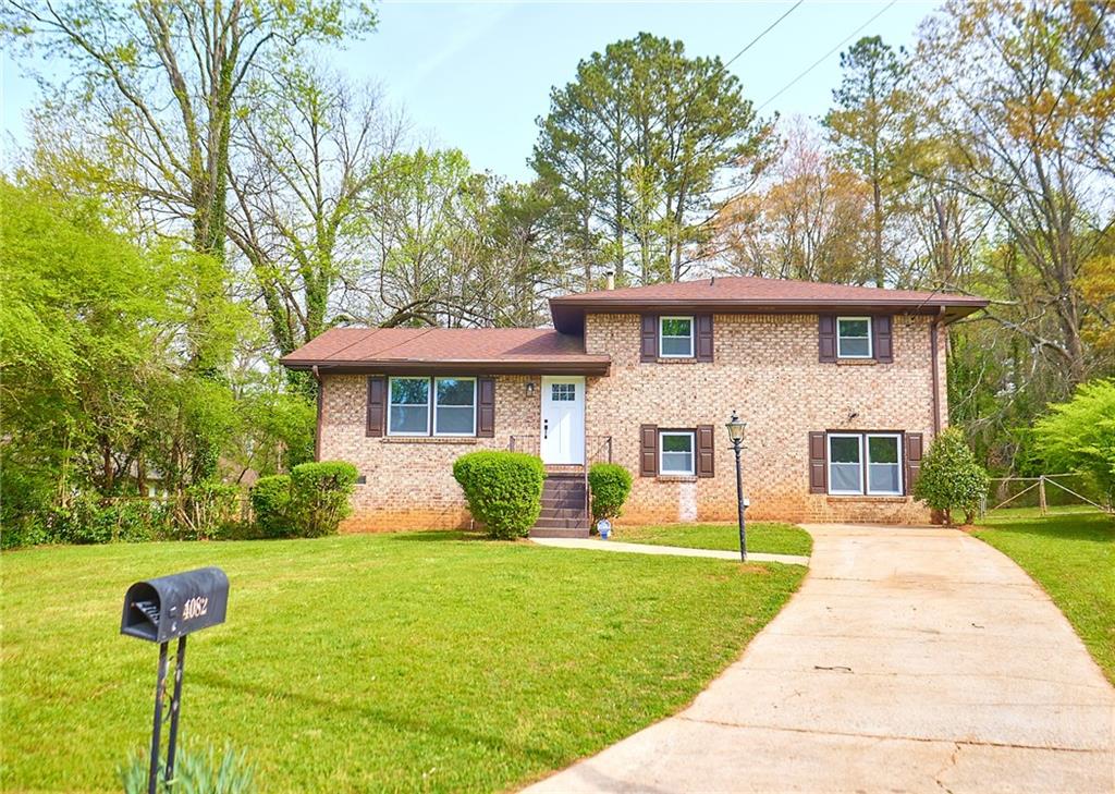 4082 Vale Court Decatur, GA 30035 - Photo 1 of 1 a front view of a house with garden
