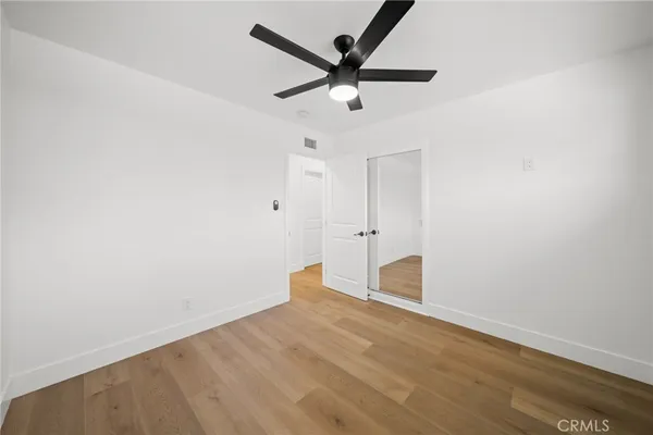 a view of a ceiling fan with wooden floor