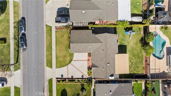 an aerial view of residential building and parking space