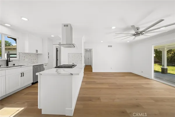 a kitchen with stainless steel appliances a stove and a refrigerator