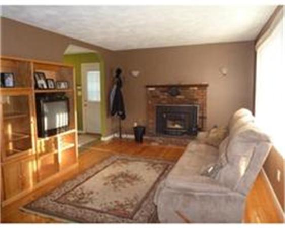 119 North Street Three Rivers, MA 01080 - Photo 6 of 6 a living room with furniture and a fireplace