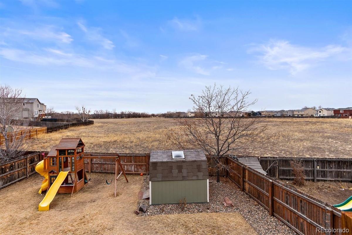 7751 Old Spec Road Peyton, CO 80831 - Photo 15 of 17 a view of a terrace with a lake view