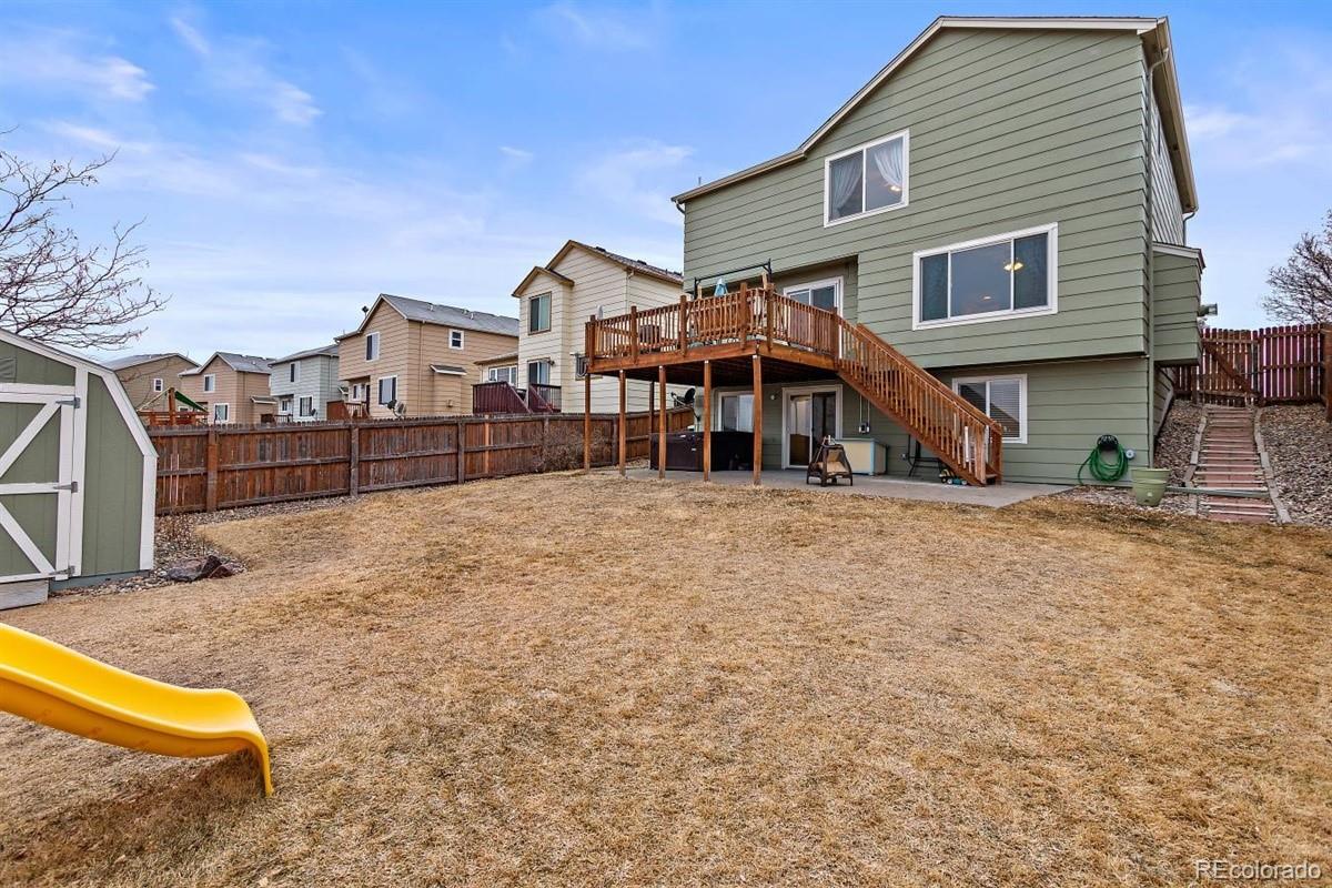 7751 Old Spec Road Peyton, CO 80831 - Photo 16 of 17 a front view of a house with a yard