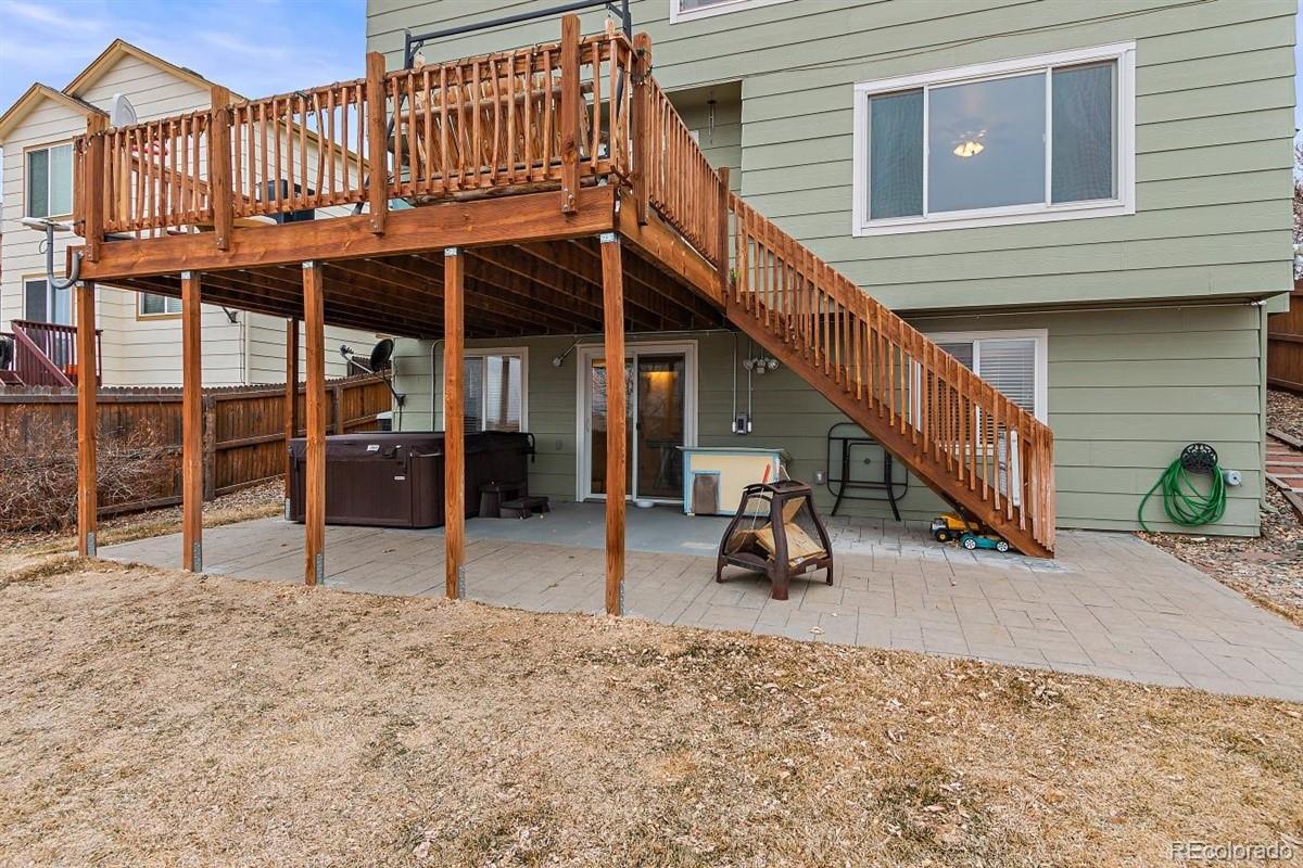7751 Old Spec Road Peyton, CO 80831 - Photo 17 of 17 a view of a house with wooden deck