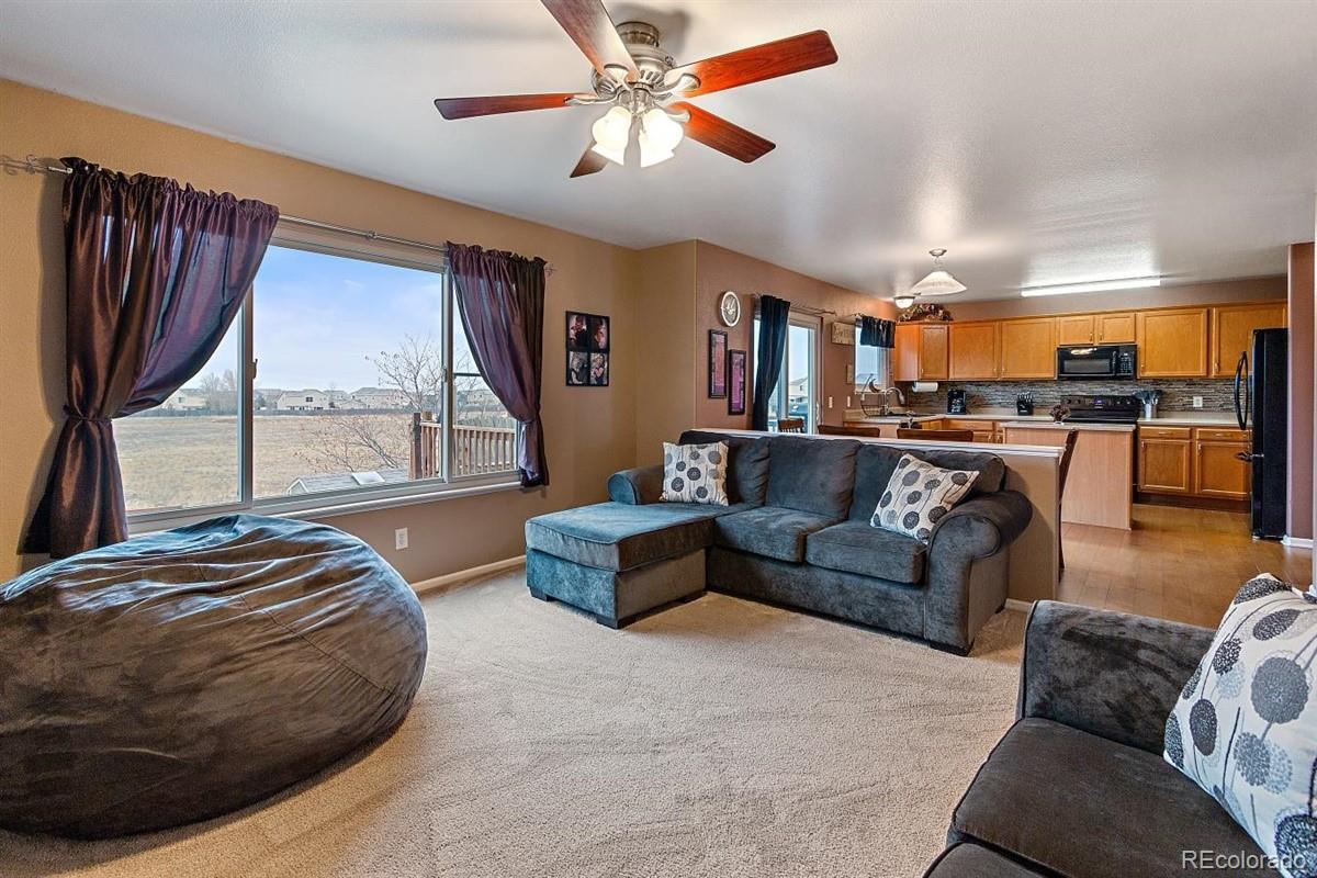 7751 Old Spec Road Peyton, CO 80831 - Photo 4 of 17 a living room with furniture and a large window