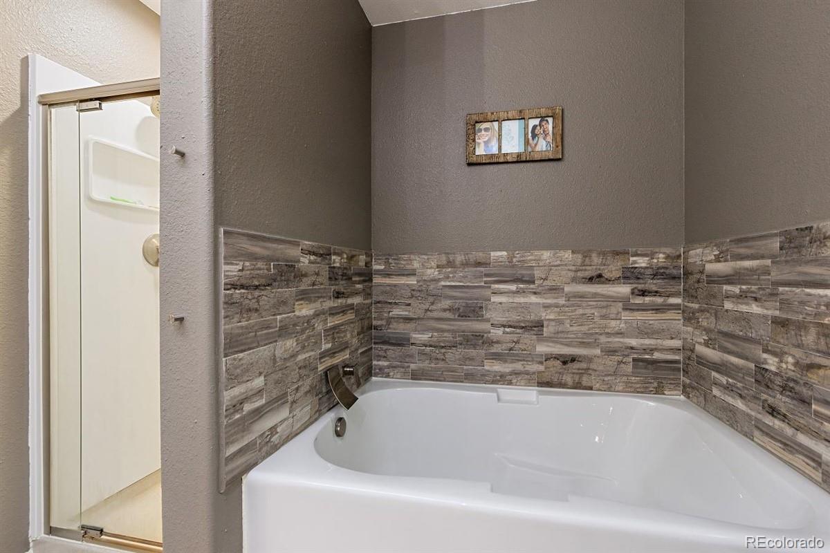 7751 Old Spec Road Peyton, CO 80831 - Photo 9 of 17 a bathroom with a tub